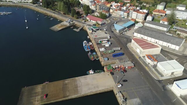 Boats in the marina. Coastal village of Galicia,Spain. Aerial Drone Video