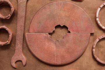 Copper set of tools and devices on a copper surface. Aircraft tools. Monochrome image. Copy space.