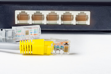 Network switch and optical fiber cables on white background