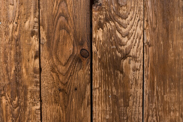 Wooden background made of boards. The tree is dark in color.
