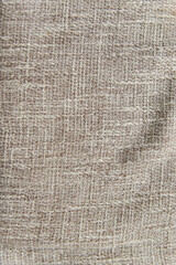 Burlap fabric, cotton fabric close-up beige and brown, with space for text.The texture of the fabric.