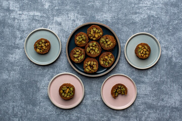 Arabic dessert or Sweets MABROUME with Pistachios.top view