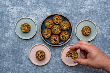 Arabic dessert or Sweets MABROUME with Pistachios.top view