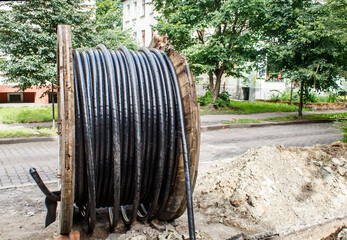 large wooden industrial reel with cable