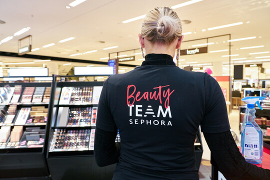 DUSSELDORF, GERMANY - CIRCA SEPTEMBER, 2018: close up shot of Beauty Team Sephora sign on clothing of a staff at Galeria Kaufhof in Dusseldorf.