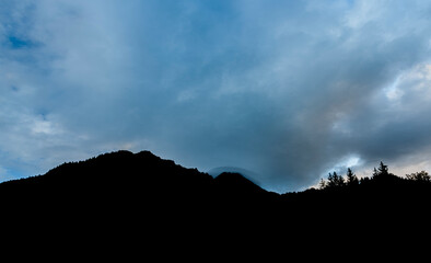 View for valley under Mittagskogel hill in summer cloudy morning