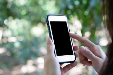 Business concept : Close up of young women hands holding cell telephone with blank copy space scree for advertising text...
