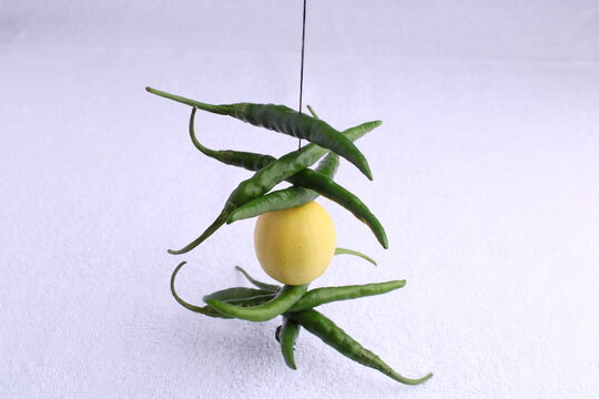 Nimbu mirchi is a indian way to keep negative energy and negativity away from people. It is widely used across india in different ways.