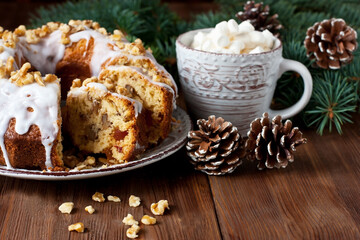 Fototapeta na wymiar Traditional raisins cake for christmas and mug with marshmallow