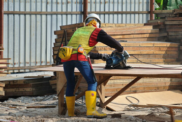 Johor, Malaysia -June 01, 2016: Carpenter working at the construction site during the daytime.