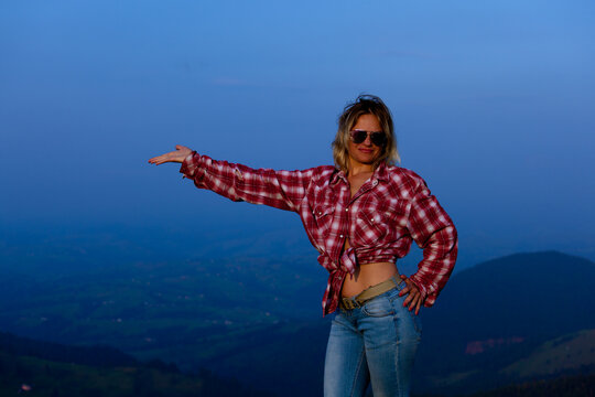 girl posing against the backdrop of a mountain