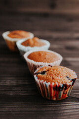 homemade cakes, cupcakes with different fillings on a dark background