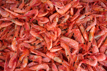 Natural background with lots of red cooked prawns