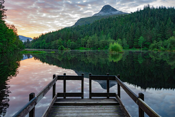 Sunrise over the Pap of Glencoe and Glencoe lochan, highlands, Scotland.