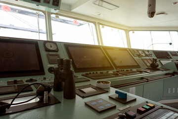Control room of cargo ship on the top bridge for navigation at sea.