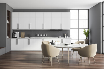 Grey and white kitchen with round table
