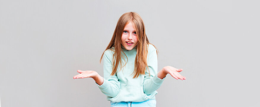 Blonde Girl Clueless And Confused Expression With Arms And Hands Raised. Doubt Concept.