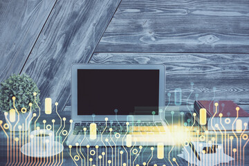 Double exposure of desktop computer and technology theme hologram. Concept of software development.