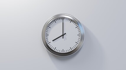 Glossy chrome clock on a white wall at eight o'clock. Time is 08:00 or 20:00