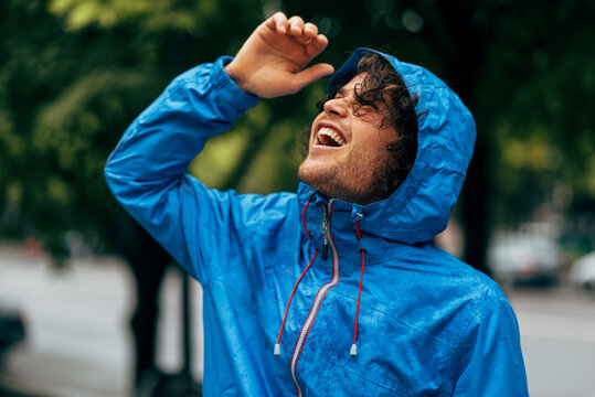 Man wearing cheap raincoat