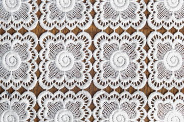 A white mat with geometric patterns. Fabric texture background.