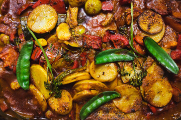 plant-based food, vegan tomato potato and snowpeas roasted in oven tray