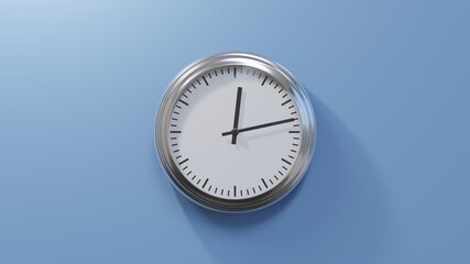 Glossy chrome clock on a blue wall at thirteen past twelve. Time is 00:13 or 12:13