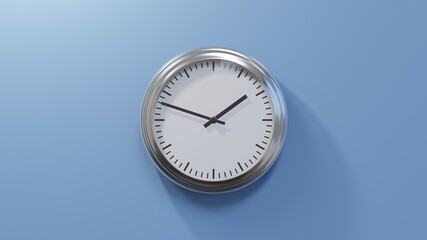 Glossy chrome clock on a blue wall at forty-eight past one. Time is 01:48 or 13:48