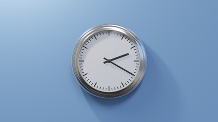 Glossy chrome clock on a blue wall at twenty past two. Time is 02:20 or 14:20