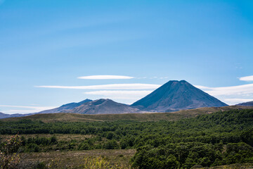 Fototapeta premium Volcanic cone of Mount Ngauruhoe rising over flat plateau