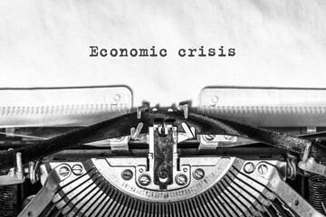 Economic Crisis text typed on vintage typewriter. Business concept