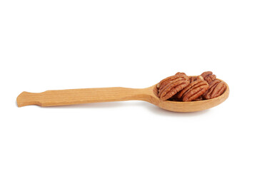 peeled pecans in a brown wooden spoon isolated on white background