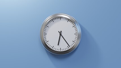 Glossy chrome clock on a blue wall at twenty-four past six. Time is 06:24 or 18:24