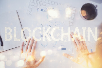 Man's hands working with notes background. Cryptocurrency and finance concept.