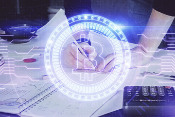 Man's hands working with notes background. Cryptocurrency and finance concept.