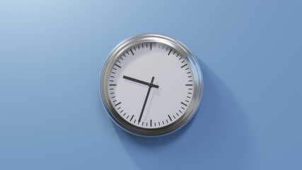 Glossy chrome clock on a blue wall at thirty-three past nine. Time is 09:33 or 21:33
