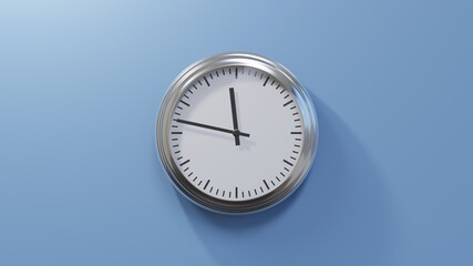 Glossy chrome clock on a blue wall at forty-seven past eleven. Time is 11:47 or 23:47