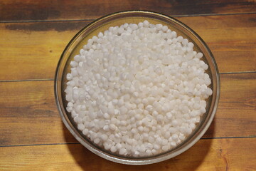 Sago or Sabudana served in a bowl over white background