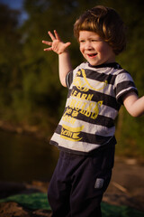 Fototapeta premium little boy playing on the beach