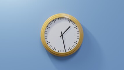 Glossy orange clock on a blue wall at twenty-eight past one. Time is 01:28 or 13:28