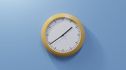 Glossy orange clock on a blue wall at thirty-nine past one. Time is 01:39 or 13:39
