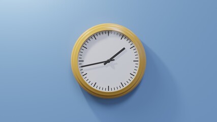 Glossy orange clock on a blue wall at forty-three past one. Time is 01:43 or 13:43