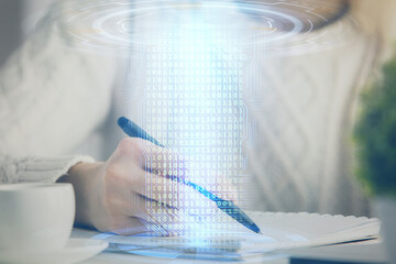 Multi exposure of writing hands on background with data solution hologram. Technology concept.