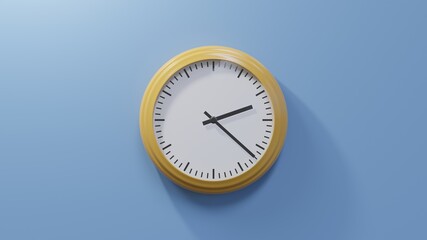 Glossy orange clock on a blue wall at twenty-two past two. Time is 02:22 or 14:22