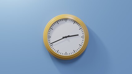 Glossy orange clock on a blue wall at forty-one past two. Time is 02:41 or 14:41
