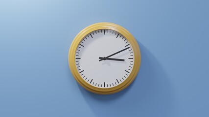 Glossy orange clock on a blue wall at eleven past three. Time is 03:11 or 15:11