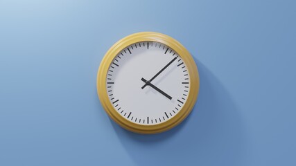 Glossy orange clock on a blue wall at eight past four. Time is 04:08 or 16:08