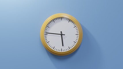 Glossy orange clock on a blue wall at forty-six past five. Time is 05:46 or 17:46