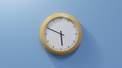 Glossy orange clock on a blue wall at forty-nine past five. Time is 05:49 or 17:49