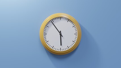 Glossy orange clock on a blue wall at fifty-four past five. Time is 05:54 or 17:54